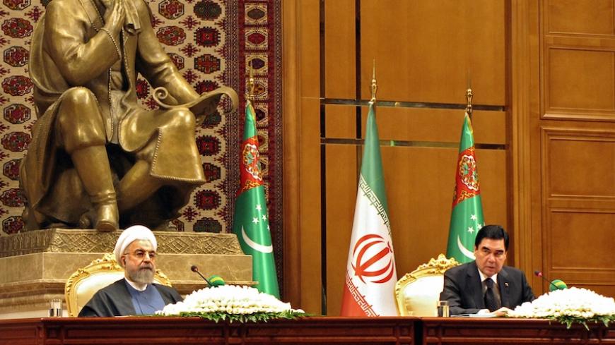 Iranian President Hassan Rouhani (L) and his Turkmen counterpart Gurbanguly Berdymukhamedov take part in a joint press conference following their meeting in Ashgabat on March 11, 2015. Hassan Rouhani is on his first state visit to Turkmenistan. AFP PHOTO / IGOR SASIN        (Photo credit should read IGOR SASIN/AFP/Getty Images)