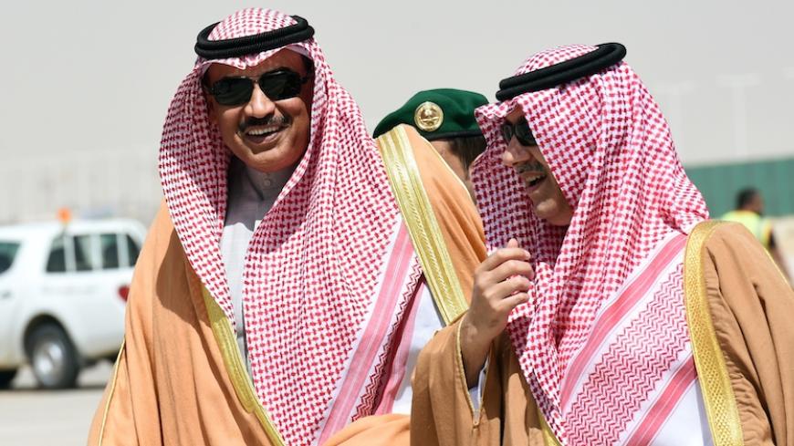 Kuwaiti Foreign Minister Sheikh Sabah al-Khaled al-Sabah (L) is escorted by Saudi  Deputy Minister of Foreign Affairs Abdulaziz bin Abdullah upon his arrival to attend the ordinary meeting of the 134th session of Gulf Cooperation Council (GCC), on March 12, 2015 in Riyadh. The Meeting will discuss developments on Yemen and Syria crisis.  AFP PHOTO / FAYEZ NURELDINE        (Photo credit should read FAYEZ NURELDINE/AFP/Getty Images)