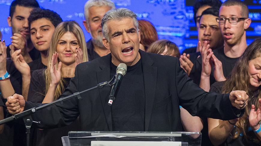Israeli MP and chairperson of center-right Yesh Atid party, Yair Lapid, delivers a speech outlining the Yesh Atid campaign and presenting the party's list for the 20th Knesset, on January 26, 2015 in the Israeli city of Rishon Letzion, ahead of the March 17 general elections.  AFP PHOTO /JACK GUEZ        (Photo credit should read JACK GUEZ/AFP/Getty Images)