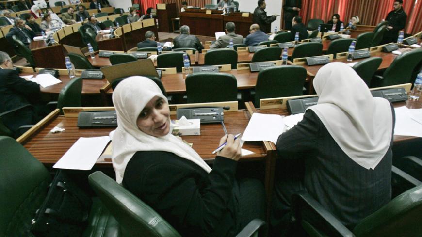 Palestinian lawmakers attend a session of the Palestinian Legislative Council in the West Bank city of Ramallah February 20, 2007. Hamas said on Tuesday it still hoped Washington would soften its position towards a Palestinian unity government following talks U.S. Secretary of State Condoleezza Rice held with Israeli and Palestinian leaders.    REUTERS/Loay Abu Haykel (WEST BANK) - RTR1MLWX