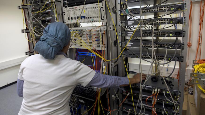 An ultra-Orthodox woman works at Matrix Global, a hi-tech company, in the West Bank Jewish settlement of Modiin Illit April 3, 2011. Ultra-Orthodox or "Haredi" women are exempt from the demands of religious studies imposed on men and the Bank of Israel says the past decade has seen "a significant increase" in ultra-Orthodox women's employment rate, now almost at 60 percent. To match Feature ISRAEL-ULTRAORTHODOX/ECONOMY   Picture taken April 3, 2011 REUTERS/Darren Whiteside (WEST BANK - Tags: RELIGION BUSINE