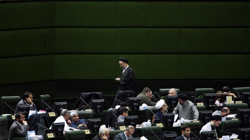 EDITORS' NOTE: Reuters and other foreign media are subject to Iranian restrictions on their ability to film or take pictures in Tehran.
Lawmakers attend a parliament session in Tehran January 29, 2012. REUTERS/Raheb Homavandi  (IRAN - Tags: POLITICS) - RTR2X0YQ