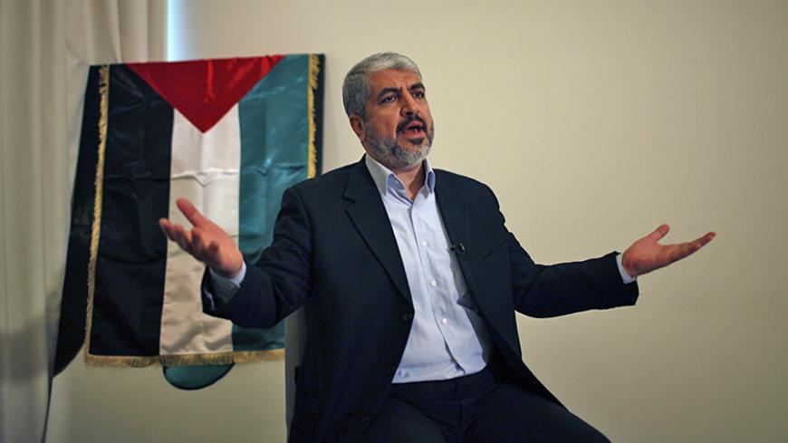 Hamas leader Khaled Meshaal gestures during his interview with Reuters in Doha November 29, 2012. Meshaal said the de facto recognition of a sovereign Palestinian state won by his rival Mahmoud Abbas should be seen alongside Gaza's latest conflict with Israel as a single, bold strategy that could empower all Palestinians. Meshaal said the short war which claimed 162 Palestinian lives and five Israelis was concluded on terms set by the Palestinian Islamist movement and ended its isolation, creating a new moo