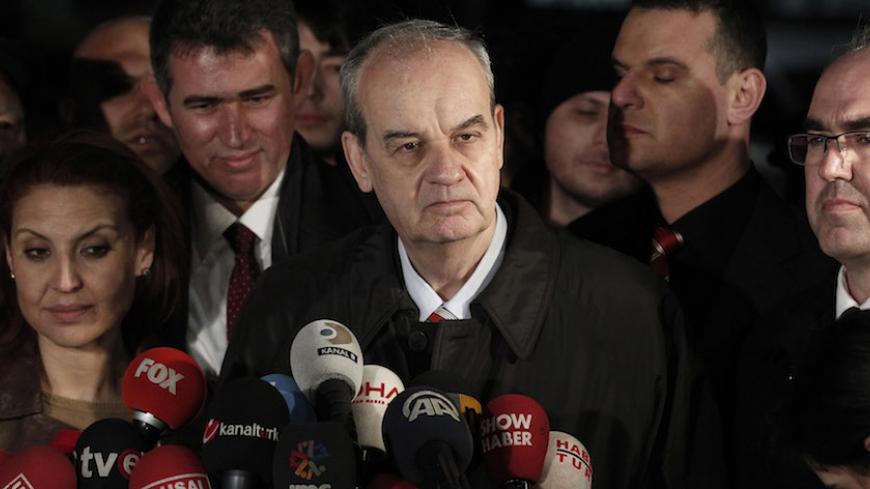 Former army chief Ilker Basbug (C) speaks to media after being released from prison outside Silivri prison complex near Istanbul March 7, 2014. A Turkish court ordered the release of Basbug from a life sentence on Friday, adding to uncertainty over the fate of court cases trying coup plots against Prime Minister Tayyip Erdogan. The decision followed a constitutional court ruling on Thursday that Basbug's incarceration for his alleged role in the 'Ergenekon' conspiracy violated his rights, as the court tryin