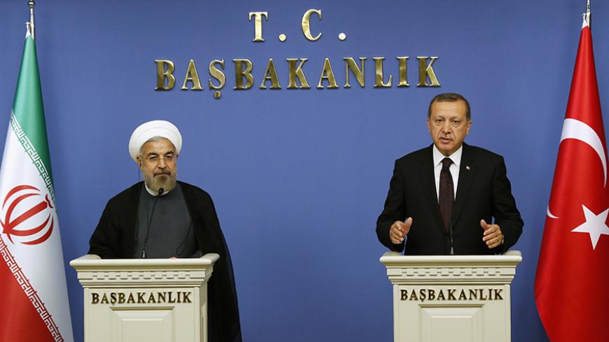 Iran's President Hassan Rouhani and Turkish Prime Minister Tayyip Erdogan attend a news conference in Ankara June 9, 2014. REUTERS/Umit Bektas (TURKEY - Tags: POLITICS) - RTR3SXIL