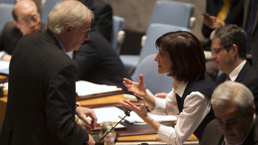 Jordanian Ambassador to the United Nations Dina Kawar (R) Speaks with British Ambassador to the U.N. Mark Layall Grant before the Security Council voted in favor of a resolution demanding the Houthi militia's withdrawal from Yemeni government institutions, during a meeting of the Council at the U.N. headquarters in New York, February 15, 2015. The United Nations Security Council on Sunday demanded Iranian-backed Houthi militia in Yemen withdraw from government institutions, called for an end to foreign inte