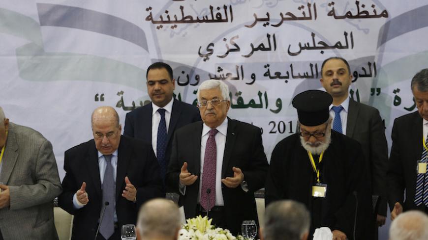 Palestinian President Mahmoud Abbas (C) prays at the start of a meeting for the Central Council of the Palestinian Liberation Organization, in the West Bank city of Ramallah, March 4, 2015. Palestinian leaders began a two-day meeting on Wednesday at which they could decide to suspend security coordination with Israel, a move that would have a profound impact on stability in the occupied West Bank. Relations between the two sides have grown dangerously brittle since the collapse of U.S.-brokered peace talks 