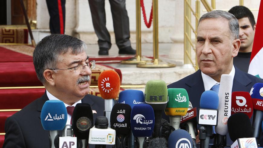 Turkey's Defence Minister Ismet Yilmaz (L) speaks during a news conference with Iraqi Defence Minister Khaled al-Obeidi in Baghdad March 4, 2015.    REUTERS/Khalid al-Mousily (IRAQ - Tags: POLITICS) - RTR4S18I