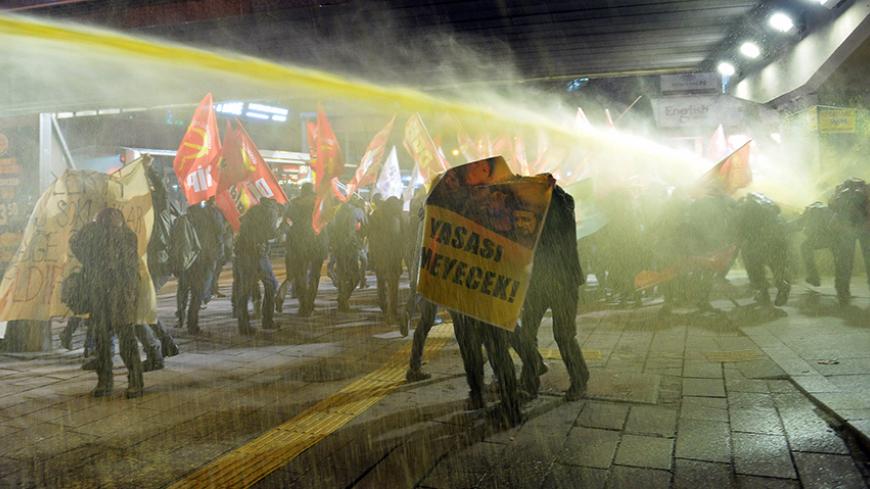 Riot police use water cannon to disperse demonstrators during a protest in Ankara March 11, 2015. Turkish police on Wednesday fired water cannon and teargas at hundreds of protesters who had gathered to mark the first anniversary of the death of a teenager fatally wounded during anti-government demonstrations. Mainly leftist protesters chanting "Berkin Elvan is immortal" clashed with police in Istanbul and Ankara. Berkin Elvan, 15, was hit in the head by a teargas canister after leaving his house to buy bre