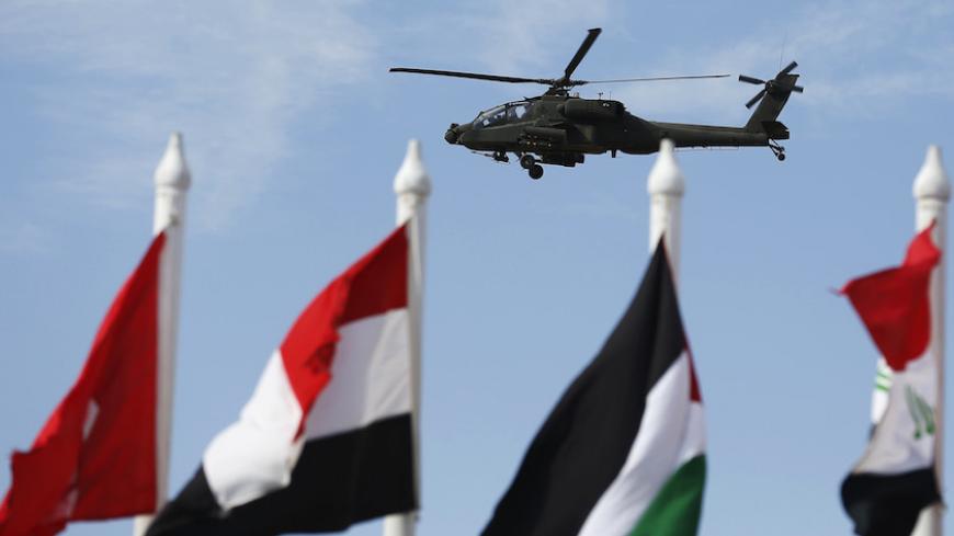 An Egyptian military helicopter flies over the conference centre hosting the Egypt Economic Development Conference (EEDC) in Sharm el-Sheikh, in the South Sinai governorate, south of Cairo, March 14, 2015. REUTERS/Amr Abdallah Dalsh  (EGYPT - Tags: BUSINESS POLITICS TRANSPORT MILITARY) - RTR4TCPP