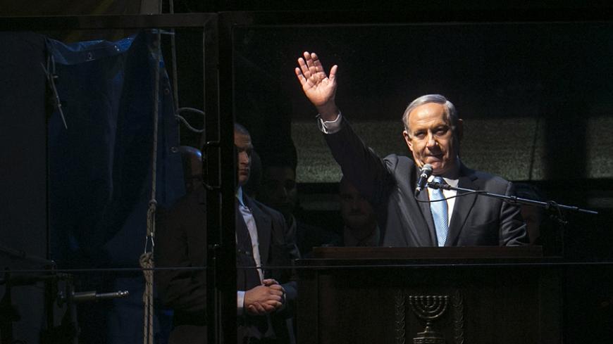 Israel's Prime Minister Benjamin Netanyahu speaks during a right-wing rally in Tel Aviv's Rabin Square March 15, 2015. Israel's centre-left opposition is poised for an upset victory in the upcoming parliamentary election, with the last opinion polls before Tuesday's vote giving it a solid lead over Prime Minister Benjamin Netanyahu's party. REUTERS/Baz Ratner (ISRAEL - Tags: POLITICS ELECTIONS) - RTR4TGPH