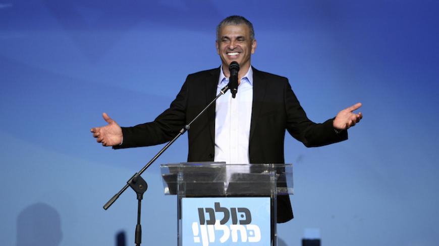 Moshe Kahlon (C), head of the new centrist party Kulanu (All of Us), addresses supporters at party headquarters in Tel Aviv March 18, 2015.  Prime Minister Benjamin Netanyahu claimed victory in Israel's election on Tuesday after exit polls showed he had erased his center-left rivals' lead with a hard rightward shift that saw him disavow a commitment to negotiate a Palestinian state. A new centrist party led by former communications minister Kahlon could be the kingmaker in coalition talks.  REUTERS/Stringer
