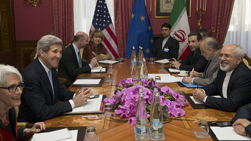U.S. Secretary of State John Kerry (2nd L) holds a negotiation meeting with Iran's Foreign Minister Mohammad Javad Zarif (R) over Iran's nuclear programme in Lausanne March 18, 2015. Also at the negotiating table is political director of the European Union's External Action Service Helga Schmid (4th L).  REUTERS/Brian Snyder   (SWITZERLAND - Tags: POLITICS ENERGY) - RTR4TU76
