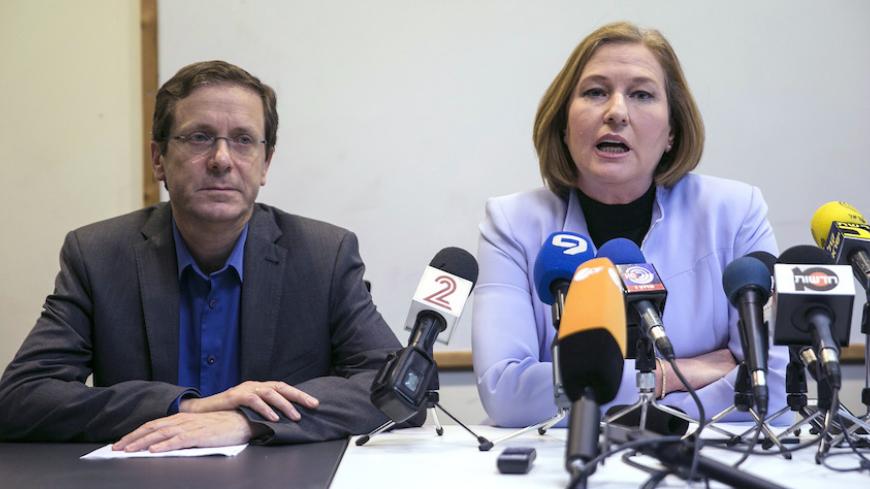 Isaac Herzog (L) and Tzipi Livni, co-leaders of Zionist Union, deliver a statement at the party headquarters in Tel Aviv March 18, 2015. Israeli Prime Minster Benjamin Netanyahu pledged on Wednesday to form a new governing coalition quickly after an upset election victory that was built on a shift to the right and is likely to worsen a troubled relationship with the White House. With nearly all votes counted on Wednesday, Netanyahu's Likud had won 30 seats in the 120-member Knesset, comfortably defeating th