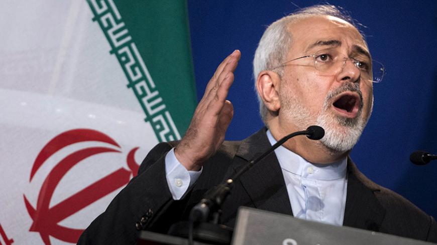 Iran's Foreign Minister Javad Zarif gestures as he speaks during a news conference at the Swiss Federal Institute of Technology in Lausanne (Ecole Polytechnique Federale De Lausanne) on April 2, 2015, after Iran nuclear program talks finished with extended sessions. Iran and world powers reached a framework agreement on Thursday on curbing Iran's nuclear programme for at least a decade after eight days of marathon talks in Switzerland. The tentative agreement clears the way for talks on a future comprehensi