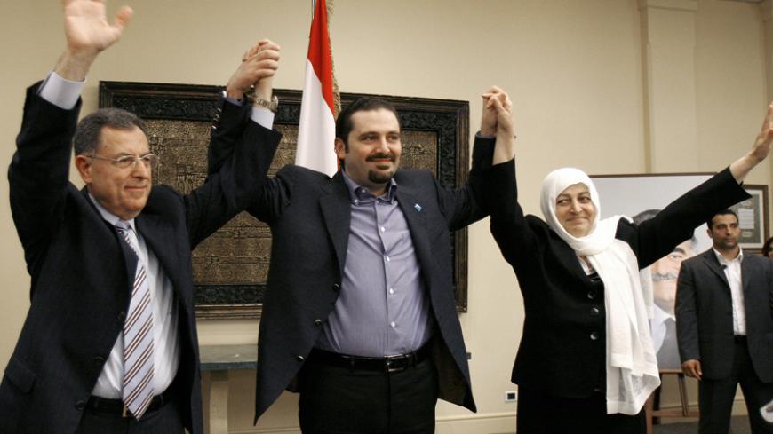 Lebanon's Prime Minister Fouad Siniora (L), Sunni Muslim politician Saad al-Hariri (C), leader of the anti-Syrian alliance, and Education Minister Bahia al-Hariri greet supporters during a parliamentary election campaign at al-Hariri's house in Beirut May 21, 2009. Lebanon's parliamentary election on June 7 is expected to be a tight contest in which Hezbollah and its allies are hoping to reverse the slim majority held by an anti-Syrian coalition that enjoys U.S. and Saudi backing. REUTERS/Jamal Saidi (LEBAN