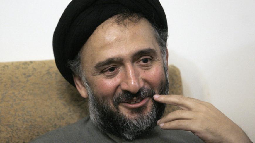 EDITORS' NOTE: Reuters and other foreign media are subject to Iranian restrictions on leaving the office to report, film or take pictures in Tehran.

Former Iranian Vice President Mohammad Ali Abtahi smiles as he sits at his home in Tehran, after he was released from jail November 22, 2009. Abtahi, accused of fomenting street unrest after Iran's June election, was released on bail of about $700,000 (424, 062 pounds) on Sunday, the judiciary said, after reports he had been sentenced to six years in jail. REU