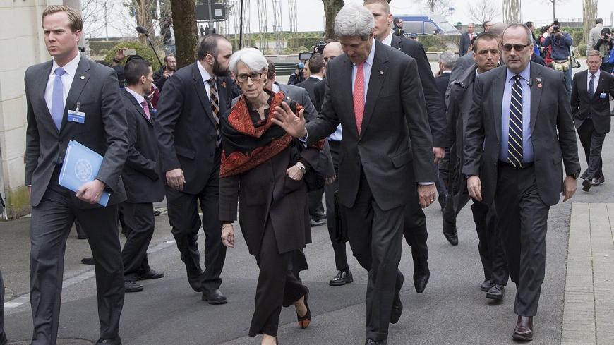 United States Secretary of State John Kerry (R) walks back to his hotel with U.S. Under Secretary for Political Affairs Wendy Sherman (L) after lunch and following a negotiating session with Iran's Foreign Minister Javad Zarif over Iran's nuclear program in Lausanne, Switzerland March 20, 2015.     REUTERS/Brian Snyder    - RTR4U6KN