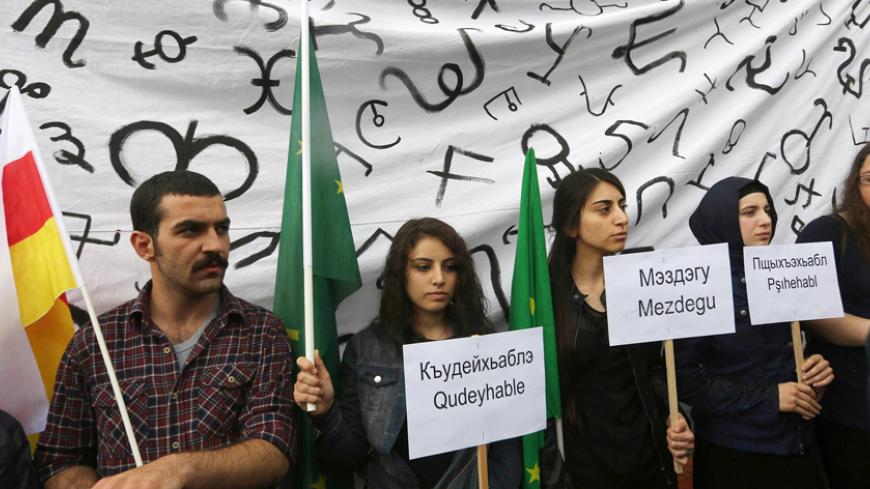 Turks of ethnic Circassian origin protest outside the Russian embassy in Ankara on May 21, 2014, on the 150th annivesary the mass deportation and killings of ethnic Circassians by Tsarist Russia in the 19th century in May 21, 1864. The north Caucasian ethnic group native to Circassia were displaced in the course of the Russian conquest of the Caucasus in the 19th century, especially after the RussianCircassian War in 1864.  AFP PHOTO/ADEM ALTAN        (Photo credit should read ADEM ALTAN/AFP/Getty Images)