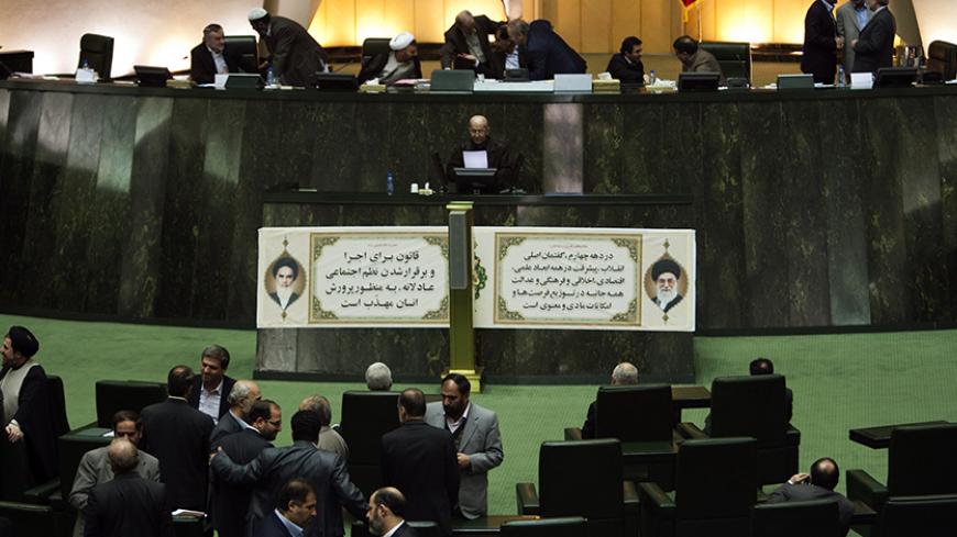 EDITORS' NOTE: Reuters and other foreign media are subject to Iranian restrictions on their ability to film or take pictures in Tehran.
Lawmakers mingle after a parliament session in Tehran January 29, 2012. REUTERS/Raheb Homavandi  (IRAN - Tags: POLITICS) - RTR2X0Z7