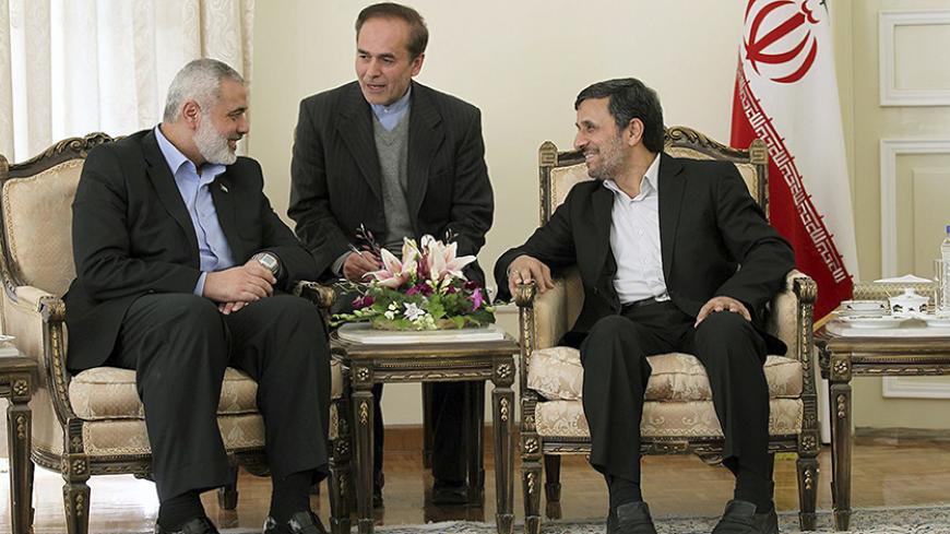 Hamas leader Ismail Haniyeh (L) speaks with Iranian President Mahmoud Ahmadinejad (R) during an official meeting in Tehran February 12, 2012. REUTERS/President.ir/Handout     (IRAN - Tags: POLITICS) FOR EDITORIAL USE ONLY. NOT FOR SALE FOR MARKETING OR ADVERTISING CAMPAIGNS. THIS IMAGE HAS BEEN SUPPLIED BY A THIRD PARTY. IT IS DISTRIBUTED, EXACTLY AS RECEIVED BY REUTERS, AS A SERVICE TO CLIENTS - RTR2XPCG