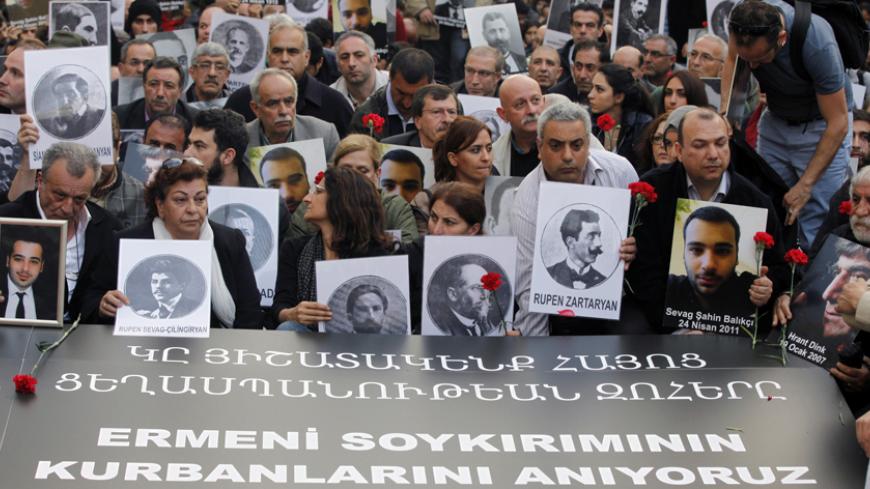 Activists hold pictures of Armenian victims during a demonstration to commemorate the 1915 mass killing of Armenians in the Ottoman Empire, in Istanbul April 24, 2014. Turkish Prime Minister Tayyip Erdogan offered on Wednesday what the government said were unprecedented condolences to the grandchildren of Armenians killed in World War One by Ottoman soldiers. In a statement issued on the eve of the 99th anniversary of the deeply contested deaths, Erdogan unexpectedly described the events of 1915 as "inhuman