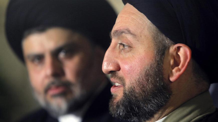 Ammar al-Hakim, leader of the Islamic Supreme Council of Iraq (ISCI), speaks during a news conference with radical Shi'ite cleric Muqtada al-Sadr in Najaf, south of Baghdad, January 23, 2015.  REUTERS/Alaa Al-Marjani (IRAQ - Tags - Tags: POLITICS RELIGION CONFLICT) - RTR4MOPE