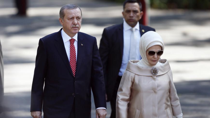Turkey's President Recep Tayyip Erdogan and his wife Emine Erdogan arrive to a wreath-laying ceremony at the Ninos Heroes monument at Chapultepec Park in Mexico City February 12, 2015. Erdogan is in Mexico for an official visit. REUTERS/Edgard Garrido (MEXICO - Tags: POLITICS) - RTR4PCQH