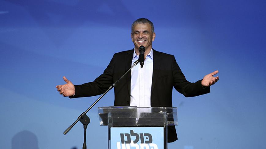 Moshe Kahlon (C), head of the new centrist party Kulanu (All of Us), addresses supporters at party headquarters in Tel Aviv March 18, 2015.  Prime Minister Benjamin Netanyahu claimed victory in Israel's election on Tuesday after exit polls showed he had erased his center-left rivals' lead with a hard rightward shift that saw him disavow a commitment to negotiate a Palestinian state. A new centrist party led by former communications minister Kahlon could be the kingmaker in coalition talks.  REUTERS/Stringer