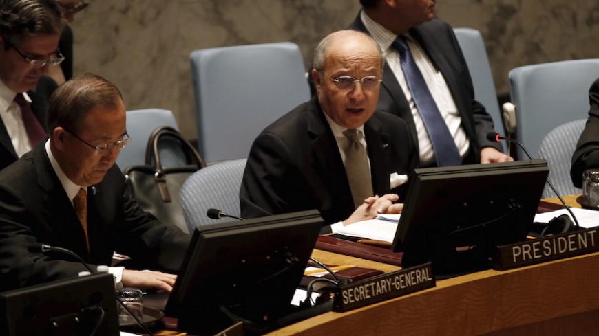 French Foreign Minister Laurent Fabius chairs a United Nations Security Council meeting on the crisis in the Middle East in France's role as the current President of Council at U.N headquarters in New York, March 27, 2015. At left is U.N. Secretary-General Ban Ki-moon. REUTERS/Mike Segar - RTR4V5PR