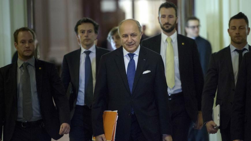 French Foreign Minister Laurent Fabius (C) walks with others during a break in a meeting with world representatives seeking to pin down a nuclear deal with Iran at the Beau Rivage Palace Hotel in Lausanne March 31, 2015. The United States said it was prepared to work past a midnight deadline into Wednesday if progress was being made towards clinching a preliminary nuclear deal between Iran and global powers. REUTERS/Brendan Smialowski/Pool - RTR4VN93