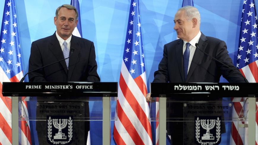 Israeli Prime Minister Benjamin Netanyahu (R) looks at the Speaker of the U.S. House of Representatives, John Boehner, as they deliver statements in Jerusalem April 1, 2015. Netanyahu said on Wednesday it was not too late for world powers still locked in nuclear negotiations with Iran to demand a "better deal". REUTERS/Debbie Hill/Pool - RTR4VQDZ