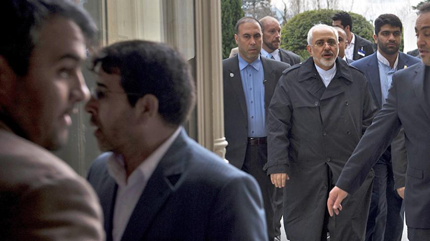 Iranian Foreign Minister Mohammad Javad Zarif (3rd R) arrives at the Beau Rivage Palace Hotel during an extended round of talks on Iran's nuclear programme, April 2, 2015, in Lausanne. REUTERS/Brendan Smialowski/Pool - RTR4VVCY