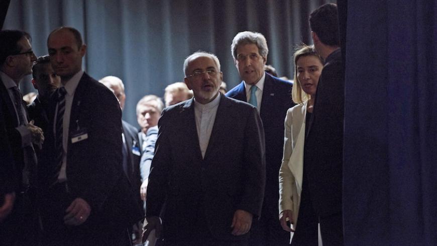 Iranian Foreign Minister Javad Zarif (centre L), U.S. Secretary of State John Kerry (centre R) and European Union High Representative Federica Mogherini (2nd R) arrive to deliver statements after nuclear talks at the Swiss Federal Institute of Technology in Lausanne (Ecole Polytechnique Federale De Lausanne) April 2, 2015. Iran and world powers reached a framework on curbing Iran's nuclear programme at marathon talks in Switzerland on Thursday that will allow further negotiations towards a final agreement. 