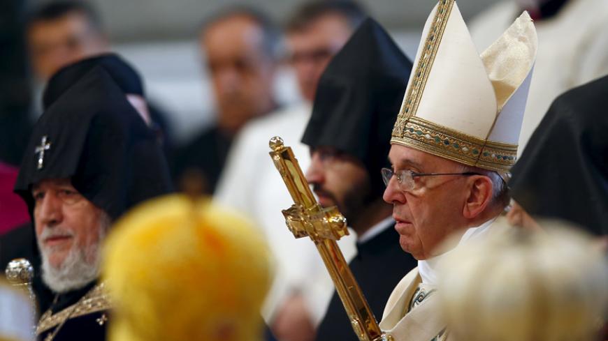 Pope Francis (R) arrives to leads a mass on 100th anniversary of the Armenian mass killings in St. Peter's Basilica at the Vatican April 12, 2015. Pope Francis on Sunday commemorated the 100th anniversary of the massacre of as many as 1.5 million Armenians as "the first genocide of the 20th century," words that could draw an angry reaction from Turkey. REUTERS/Tony Gentile  - RTR4WZ03