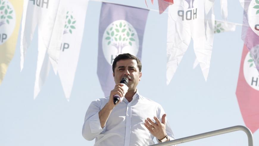 Selahattin Demirtas, co-chairman of the pro-Kurdish Peoples' Democracy Party (HDP), greets his supporters during an election rally for Turkey's June 7 parliamentary elections in Istanbul April 12, 2015.   REUTERS/Osman Orsal - RTR4X0EJ