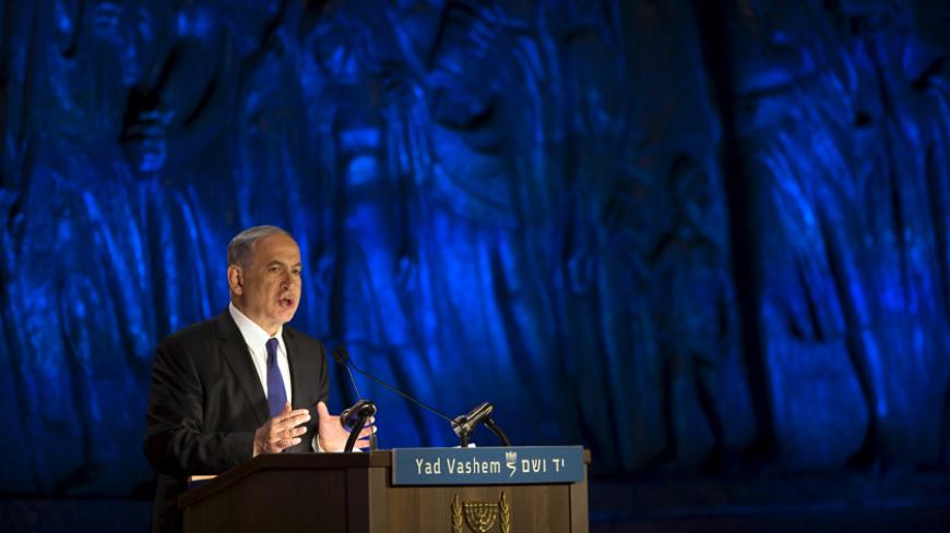 Israel's Prime Minister Benjamin Netanyahu speaks during the opening ceremony of Holocaust Memorial Day at the Yad Vashem Holocaust Memorial in Jerusalem April 15, 2015. Starting Wednesday evening, Israel marks the annual memorial day commemorating the six million Jews killed by the Nazis in the Holocaust during World War Two. REUTERS/Ronen Zvulun  - RTR4XHVD