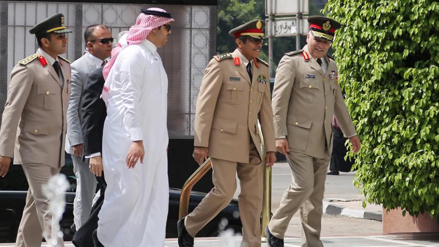 Abdulrahman Al-Banyan (2nd R), Saudi Arabia's Chief of Staff, arrives to the Arab League headquarters to attend an Arab defence ministers meeting in Cairo April 22, 2015. The talks are expected to focus on the war in Yemen, Iran’s growing influence in the Middle East and security threats from Islamic State. REUTERS/Asmaa Waguih