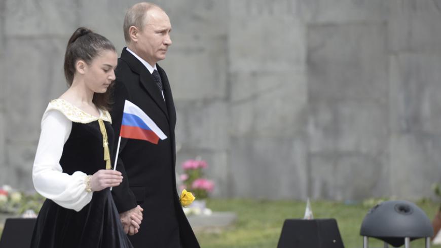 Russia's President Vladimir Putin (R) attends a commemoration ceremony marking the centenary of the mass killing of Armenians by Ottoman Turks in Yerevan, Armenia, April 24, 2015. Armenia's president said on Wednesday he was ready to normalize relations with Turkey, two months after he withdrew peace accords from parliament, blaming a Turkish lack of political will to end 100 years of hostility. Speaking ahead of Friday's centenary of the mass killing of Armenians by Ottoman Turks which is at the heart of t