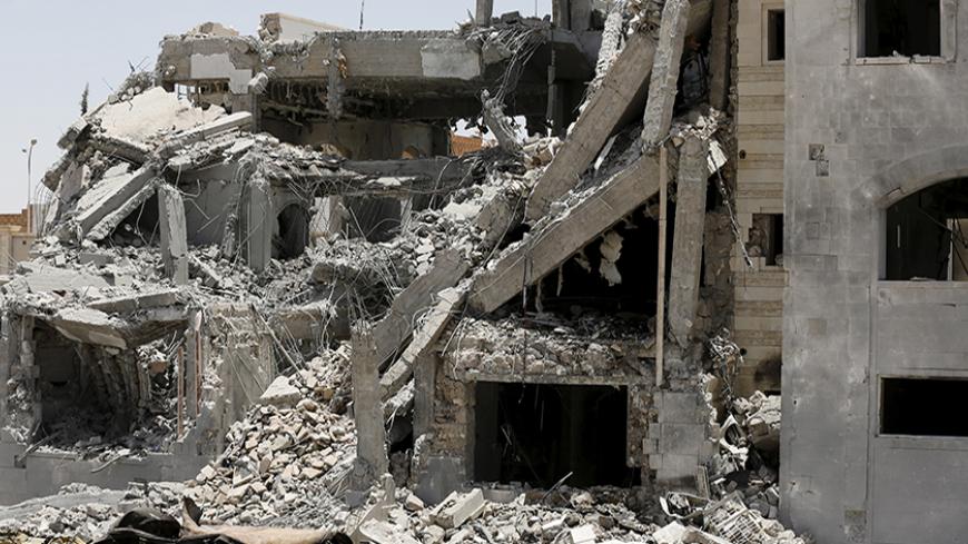 The residence of the military commander of the Houthi militant group, Abdullah Yahya al Hakim, is seen after an airstrike destroyed it in Sanaa April 28, 2015. Saudi-led aircraft pounded Iran-allied Houthi militiamen and rebel army units on Monday, dashing hopes for a pause in fighting to let aid in as relief officials warned of a catastrophic humanitarian crisis. REUTERS/Khaled Abdullah - RTX1AM7D