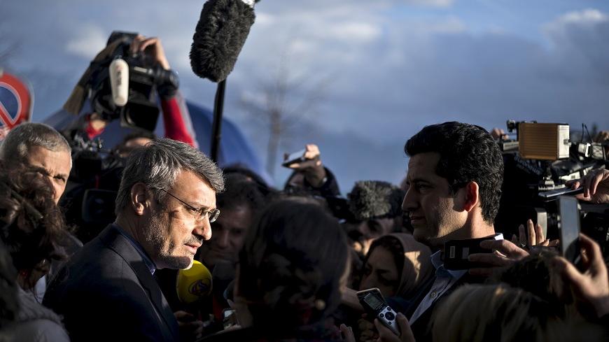 Hamid Baeedinejad (L), an Iranian official, speaks with press about negotiations on Iran's nuclear programme outside the Beau Rivage Palace Hotel in Lausanne March 31, 2015. The United States said it was prepared to work past a midnight deadline into Wednesday if progress was being made towards clinching a preliminary nuclear deal between Iran and global powers. REUTERS/Brendan Smialowski/Pool - RTR4VMZY