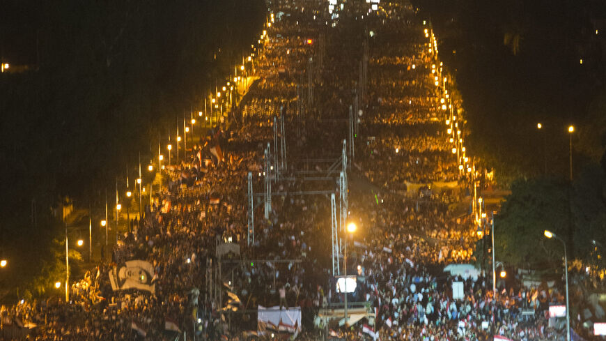 Egyptian demonstrators gather outside the presidential palace in Cairo during a protest calling for the ouster of President Mohamed Morsi on July 1, 2013. Egypt's armed forces warned that it will intervene if the people's demands are not met within 48 hours, after millions took to the streets to demand the president's resignation. AFP PHOTO / KHALED DESOUKI        (Photo credit should read KHALED DESOUKI/AFP/Getty Images)