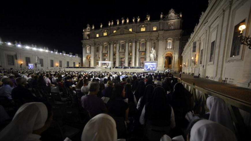 Nuns pray in Saint Peter square during a mass at the Vatican on September 7, 2013. The pope has called for a global day of fasting and prayer on Saturday for peace in Syria and against any armed intervention.  AFP PHOTO / Filippo MONTEFORTE        (Photo credit should read FILIPPO MONTEFORTE/AFP/Getty Images)