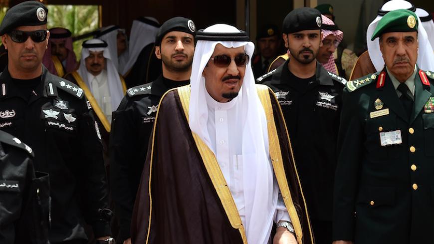 Saudi King Salman bin Abdulaziz (C) walks surrounded by security officers to receive Bahraini King Hamad bin Isa al-Khalifa (unseen) upon the latter's arrival in Riyadh to attend the Gulf Cooperation Council (GCC) summit on May 5, 2015. AFP PHOTO / FAYEZ NURELDINE        (Photo credit should read FAYEZ NURELDINE/AFP/Getty Images)