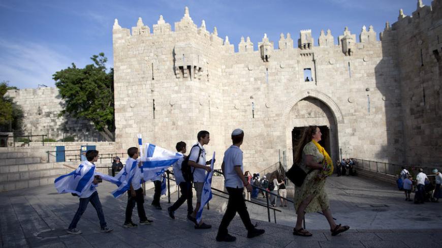 JERUSALEM, ISRAEL - MAY 28:  (ISRAEL OUT) Israelis during a march marking Jerusalem Day on May 28, 2014 outside Jerusalem's old city, Israel. Israel is celebrating the anniversary of the 'unification' of Jerusalem, marking 47 years since it captured mainly Arab east Jerusalem during the 1967 Middle East war.  (Photo by Lior Mizrahi/Getty Images)