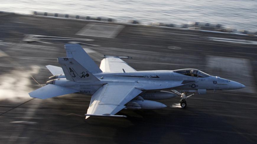A F/A-18E Super Hornet of the Strike Fighter Squadron 31, known as the Tomcatters, conducts an arrested landing onboard the USS Theodore Roosevelt aircraft carrier in the Arabian Sea December 3, 2008. Picture taken December 3, 2008. REUTERS/Hamad I Mohammed (ARABIAN SEA) - RTR22B6Q