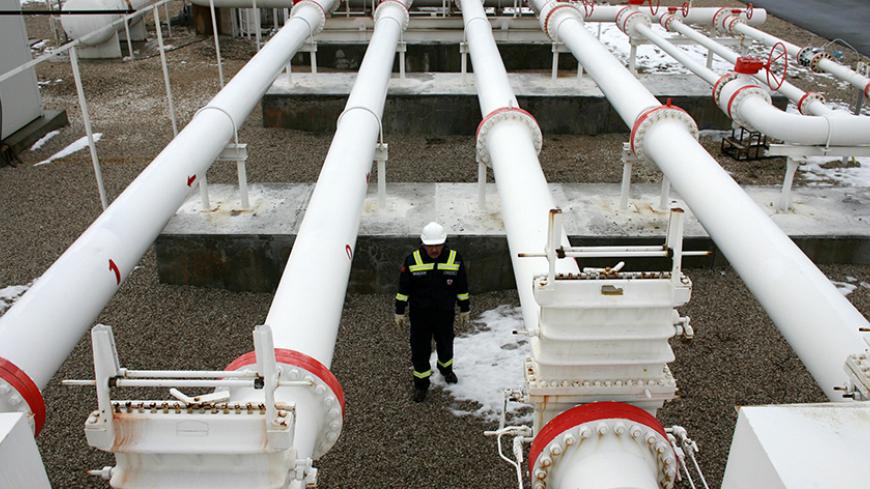 A worker carries out a routine check in a natural gas control centre of Turkey's Petroleum and Pipeline Corporation, 35 km (22 miles) west of Ankara, January 5, 2009. The European Union on Monday scheduled talks with Russia to press for a speedy resolution of a dispute with Ukraine that has hit gas supplies to countries in eastern and southern Europe facing freezing temperatures. Turkey has increased gas delivered direct from Russia via the Blue-Stream pipeline under the Black Sea to compensate for a slight