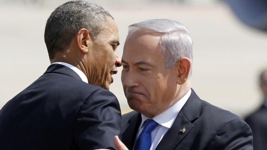 U.S. President Barack Obama hugs Israeli Prime Minister Benjamin Netanyahu at Ben Gurion International Airport Airport in Tel Aviv March 20, 2013. Obama said at the start of his first official visit to Israel on Wednesday that the U.S. commitment to the security of the Jewish state was rock solid and that peace must come to the Holy Land.  REUTERS/Jason Reed (ISRAEL - Tags: POLITICS) - RTR3F8UU