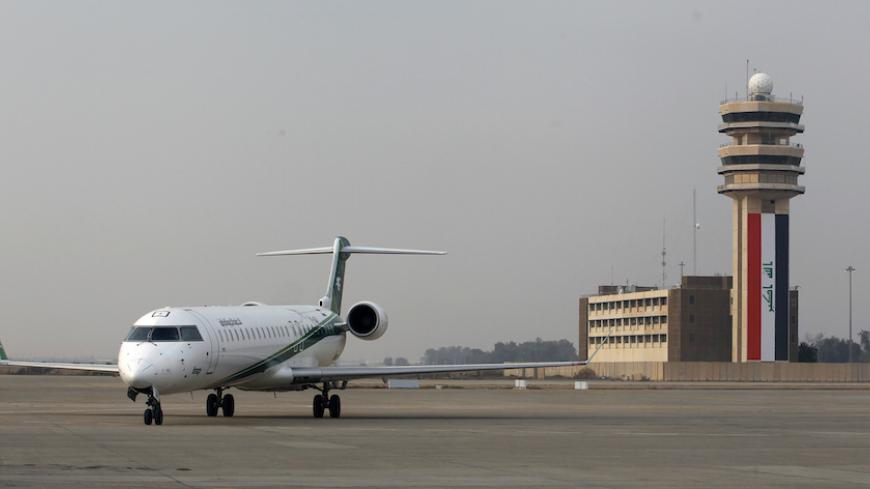 An Iraqi Airways plane lands at Baghdad International airport January 27, 2015. Airlines from at least three countries suspended flights to Baghdad on Tuesday after bullets hit an airplane operated by budget carrier Dubai Aviation Corp, known as flydubai, as it was landing at Baghdad airport. Company officials said Iraqi Airways and Iran's Caspian Airlines were operating flights to Baghdad on a normal schedule. REUTERS/Thaier Al-Sudani (IRAQ - Tags: CIVIL UNREST POLITICS TRANSPORT) - RTR4N5YY