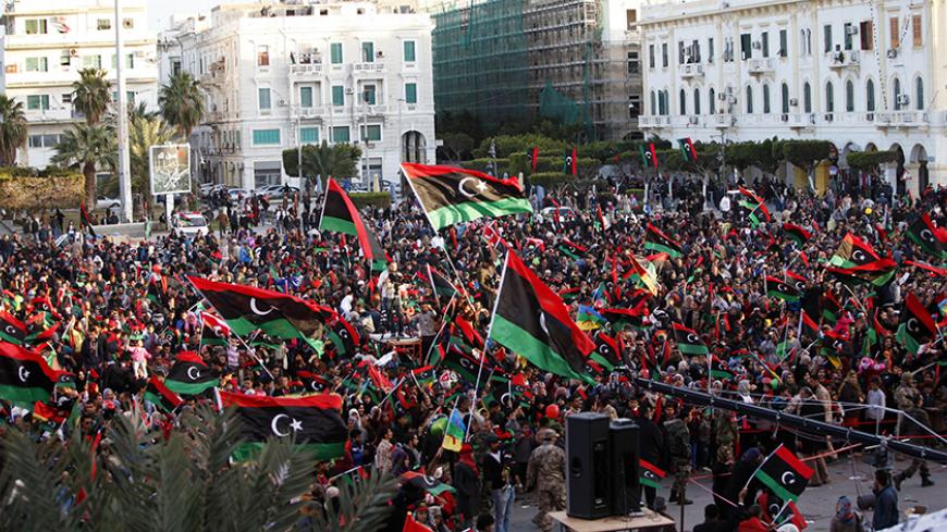 Libyans celebrate the fourth anniversary of the revolution against Muammar Gaddafi at Martyrs' Square in Tripoli, February 17, 2015. REUTERS/Ismail Zitouny (LIBYA - Tags: POLITICS CIVIL UNREST ANNIVERSARY) - RTR4PZQO